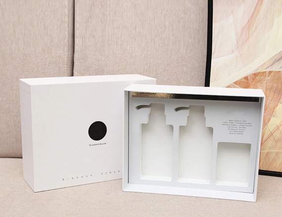 white cardboard boxes with inserts